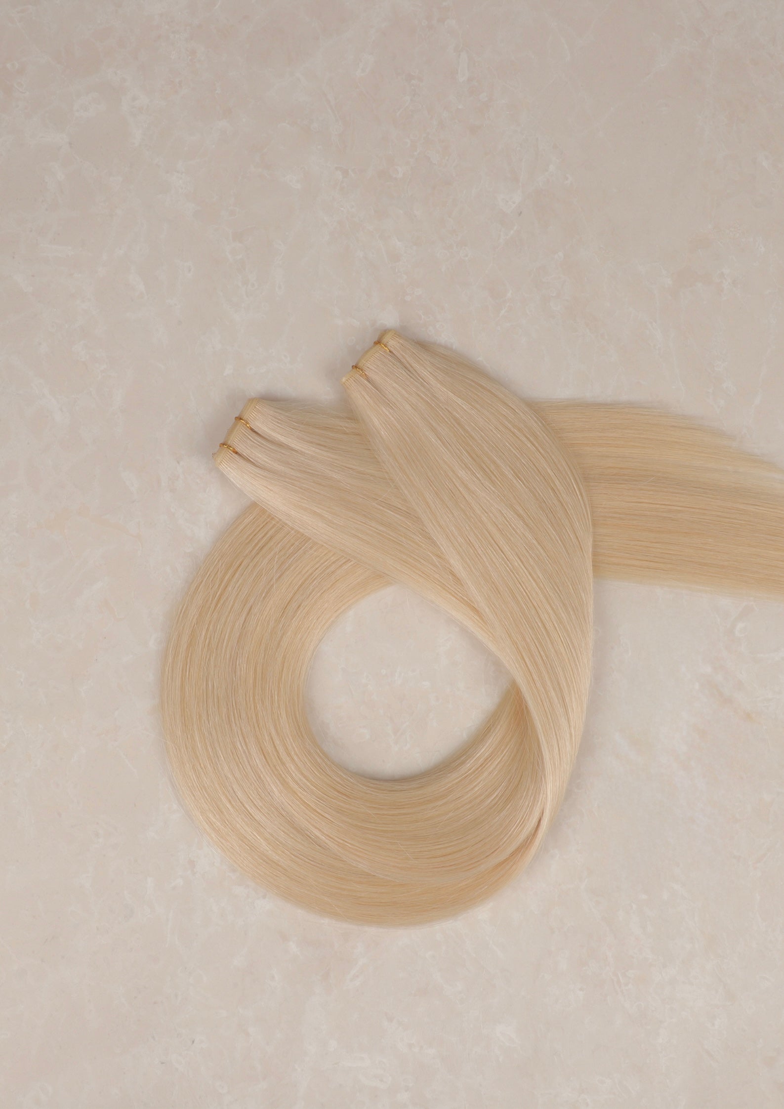 Human Hair Extensions. Champagne Blonde