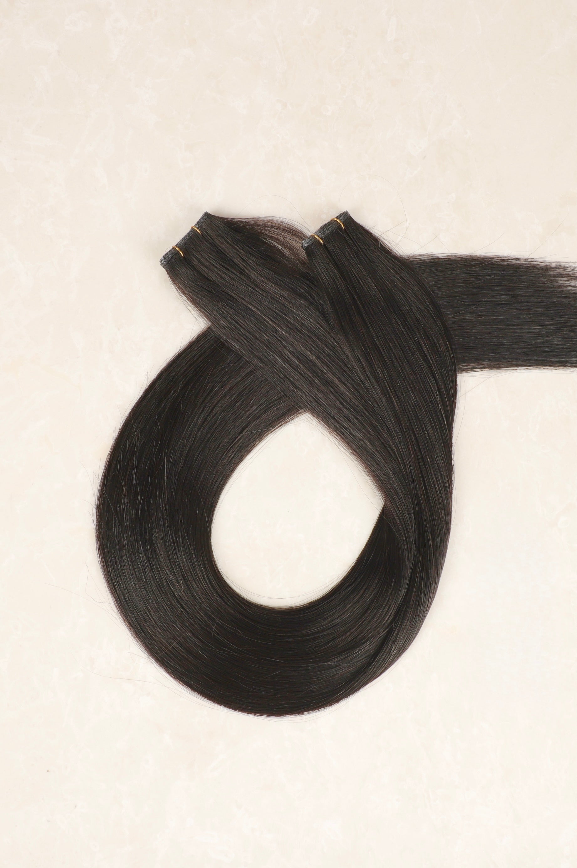 Human Hair Extensions. Natural Black